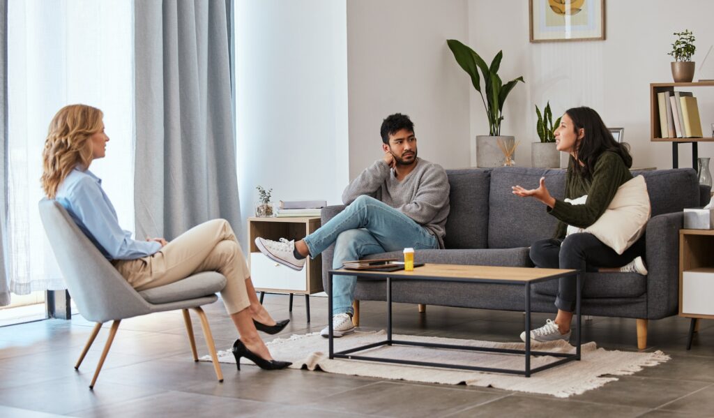 Shot of a couple having an argument during a counseling session with a therapist