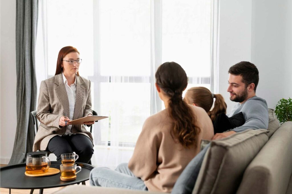 Therapist having session with couple and their child